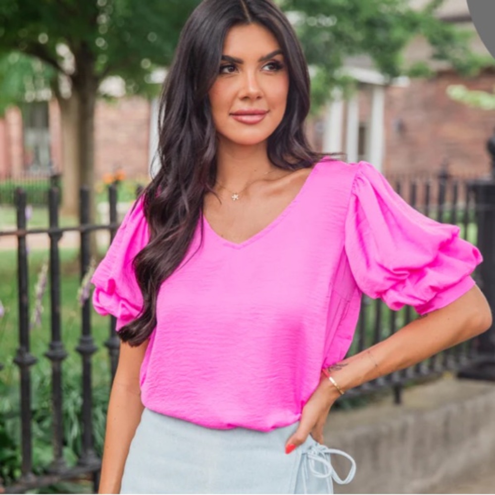 NWOT.  Stunning pink ruffle sleeve top
